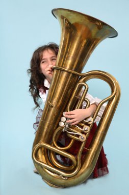 Young girl playing the horn