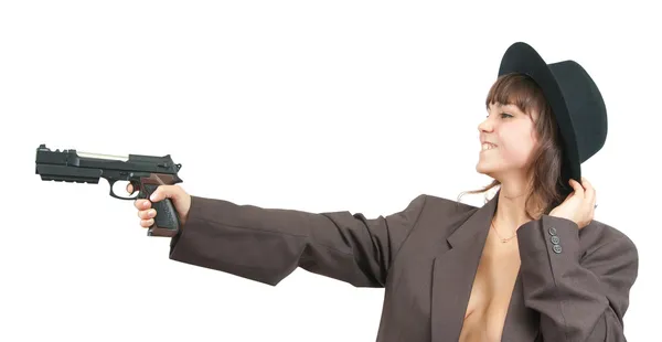 The girl with a pistol on an isolated ba — Stock Photo, Image