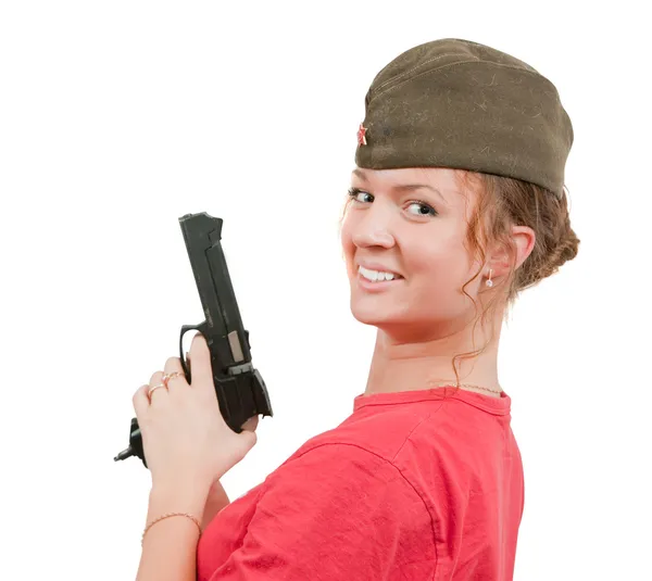 Девушка в заграничной кепке держит пистолет . — стоковое фото