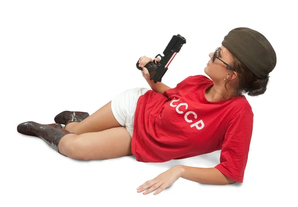 Girl in overseas cap holding gun. — Stock Photo, Image