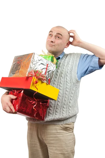 Thoughtful men with christmas gifts over — Stock Photo, Image