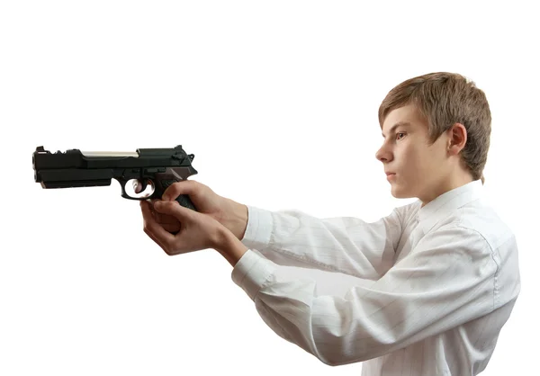 Young man aiming a black gun — Stock Photo, Image