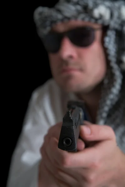 Angry terrorist. Focus over gun — Stock Photo, Image