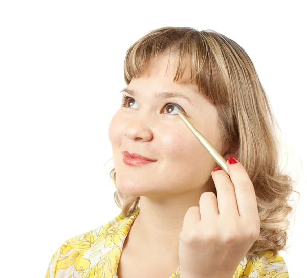 Flicka kosmetika göra en make-up — Stockfoto
