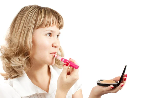 Girl applying lipstick over white — Stock Photo, Image