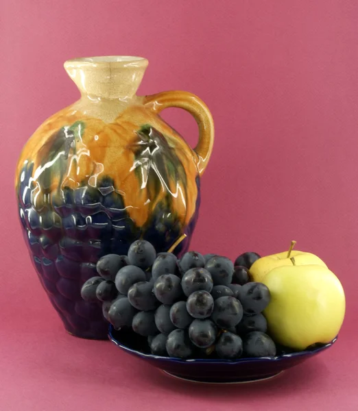 Decanter with fruits — Stock Photo, Image