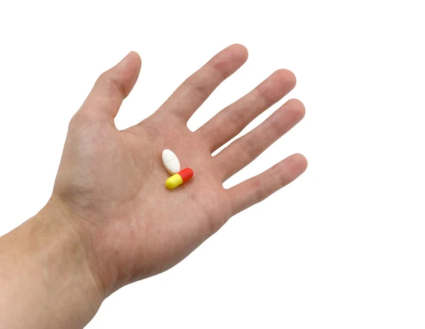 Hand met pillen — Stockfoto