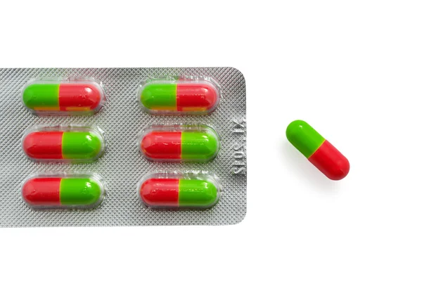 Изолированные таблетки с пакетом — стоковое фото