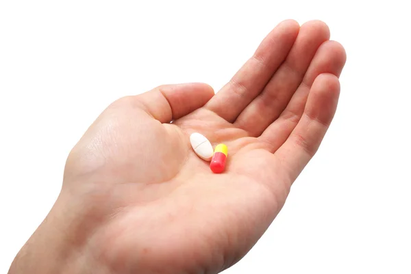 Ludzkiej dłoni i dwie tabletki — Zdjęcie stockowe
