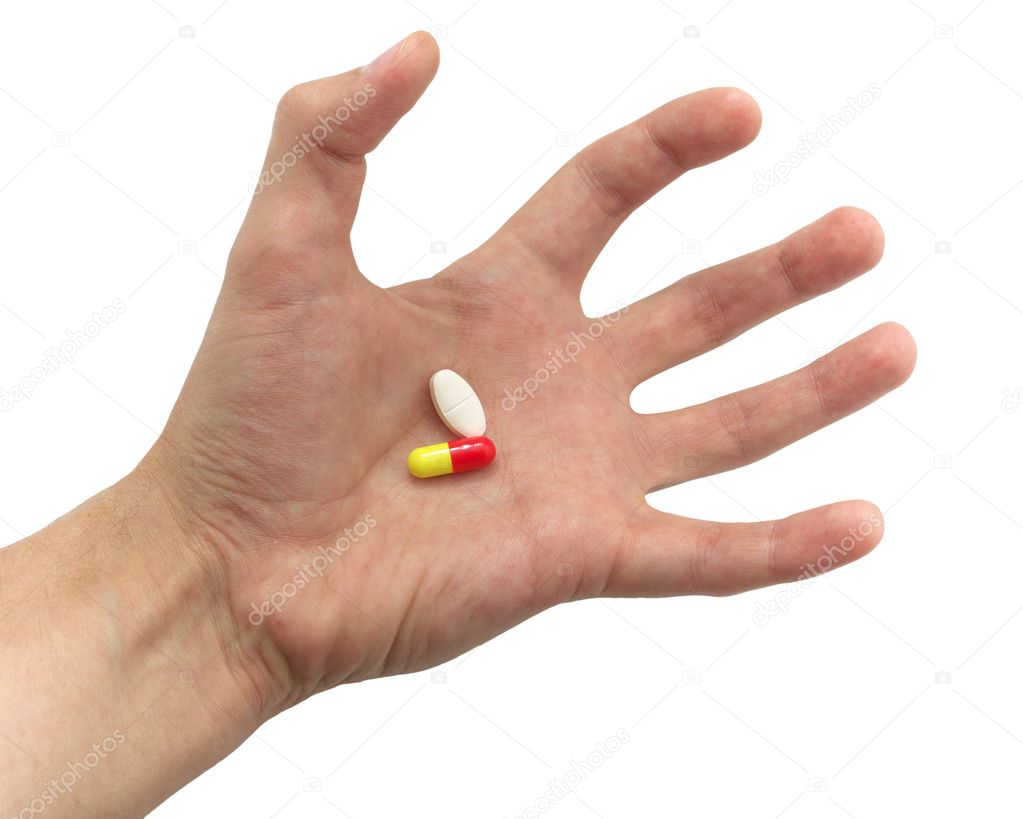 Tense hand with pills