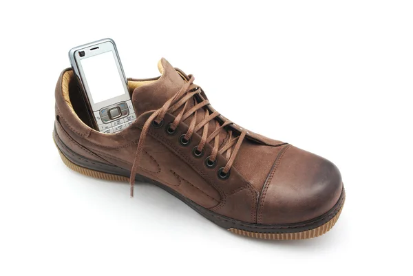 Mobiele telefoon in schoen — Stockfoto