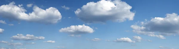 Άσπρα σύννεφα σε έναν γαλάζιο ουρανό — Φωτογραφία Αρχείου