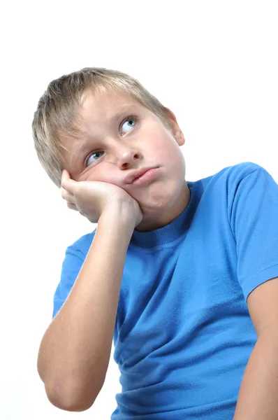 Portrait of young boy sitting isolated — Stock Photo, Image