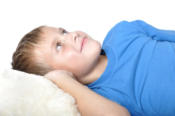 Boy rests upon pillow — Stock Photo, Image