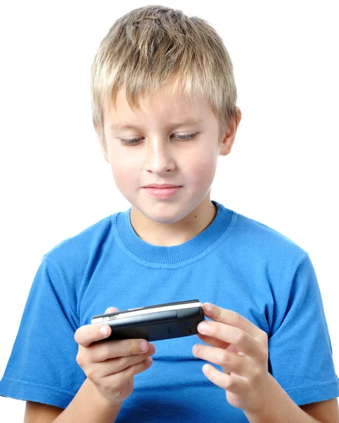 Liten pojke experimentera med en cellphon — Stockfoto