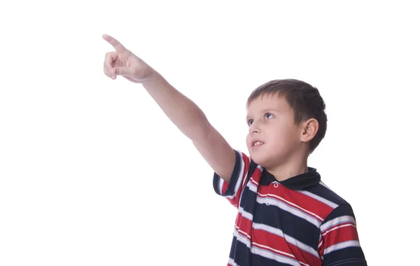 Pojken tittar upp och pekar uppåt — Stockfoto