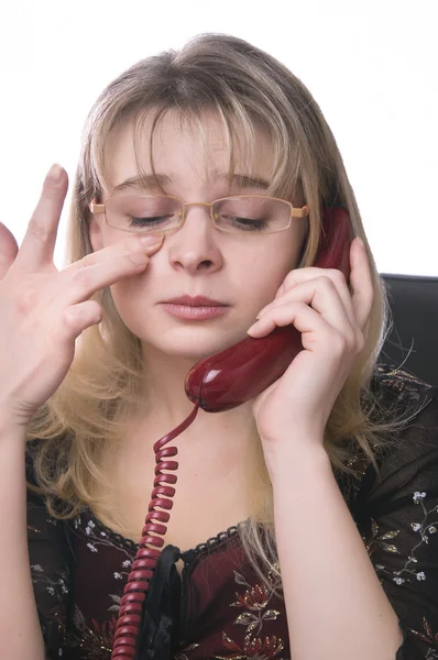 Crying girl secretary with a phone — Stock Photo, Image