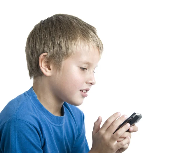 Chłopiec gra na komórkę — Zdjęcie stockowe