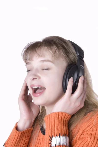 Dívka poslouchá hudbu a zpěv — Stock fotografie