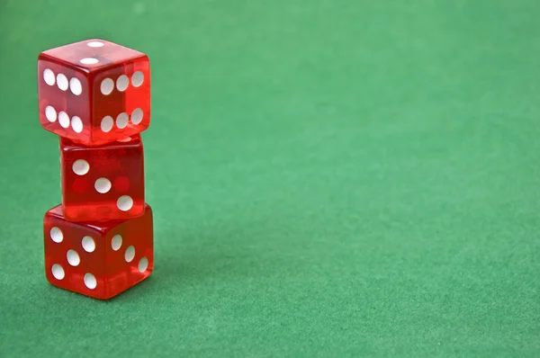 Dice against green baize — Stock Photo, Image