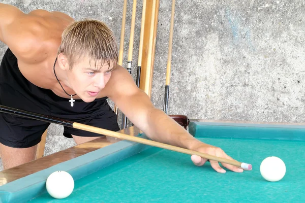 stock image Young guy playing pool