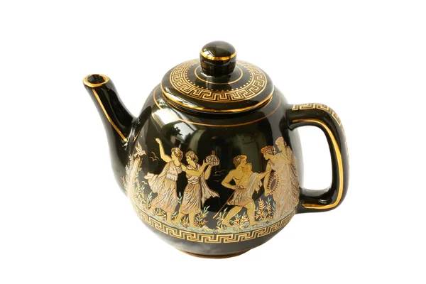 Черный чайник для варки чая с золотом — стоковое фото