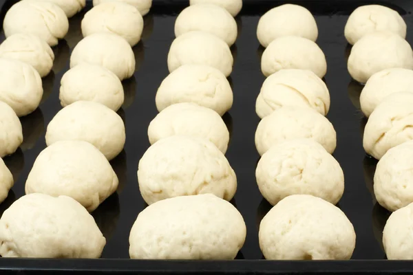 Harvesting of dough for buns — Stock Photo, Image