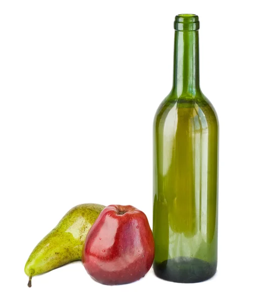 Бутылки и фрукты — стоковое фото