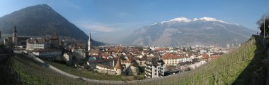 Top of mountain Calanda is covered snow clipart