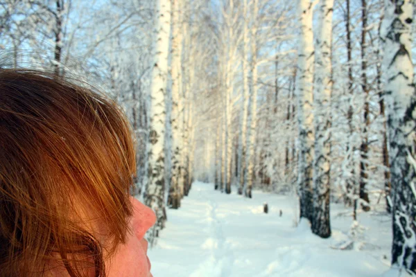 Woman with red hair, looking on winter w — Stock Photo, Image