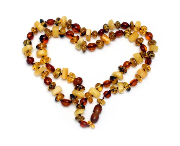 Heart shape from amber necklace — Stock Photo, Image