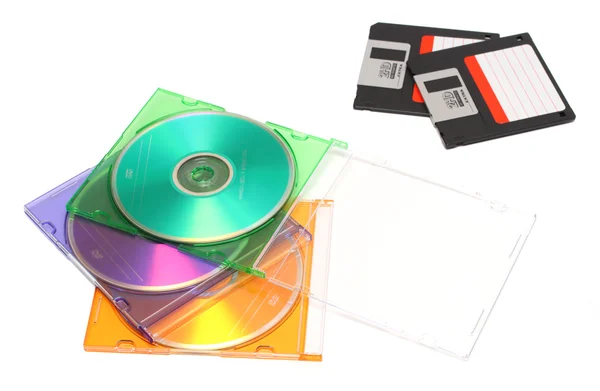 Gekleurde dvd en oude floppy disks — Stockfoto