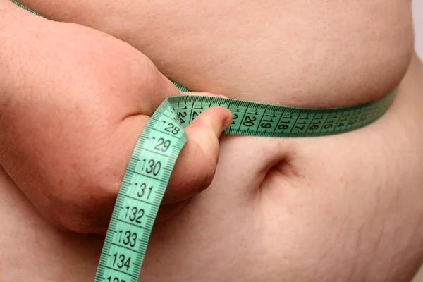Brzuch kobiety z nadwagą — Zdjęcie stockowe