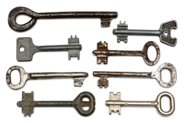 Acht alte rostige Schlüssel — Stockfoto