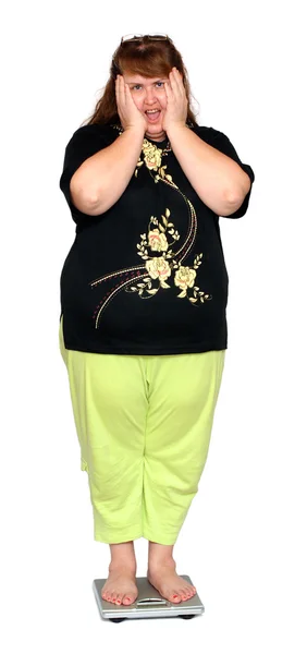 Kvinnor med övervikt på skalor — Stockfoto