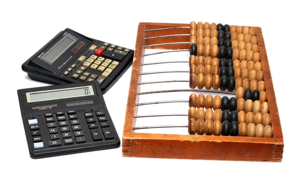 Old abacus and two calculators Stock Photo