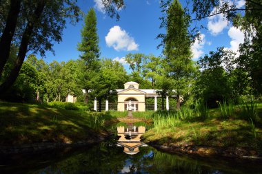 Pavilion with sculpture in park clipart