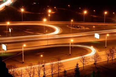 Traffic on night road junction clipart