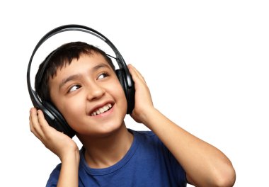 Boy listening music in headphones clipart