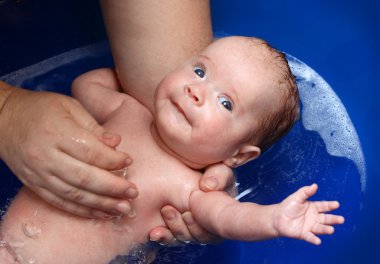 Newborn baby in bathtub clipart