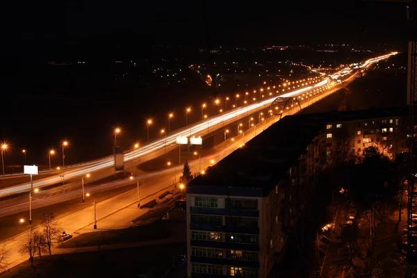 Night road through bridge — Stock Photo, Image