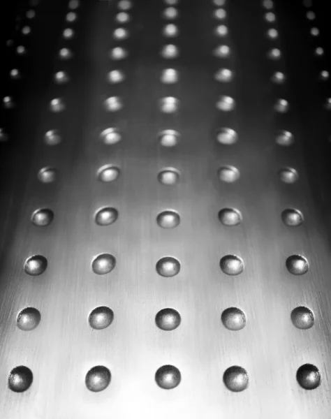 Metal surface background with holes — Stock Photo, Image