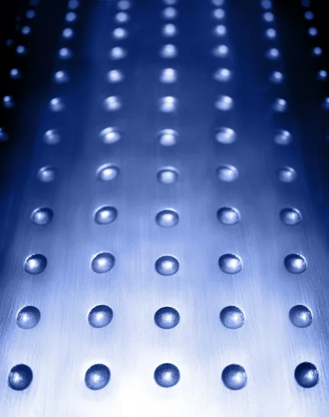Blaue Metalloberfläche Hintergrund mit Löchern — Stockfoto