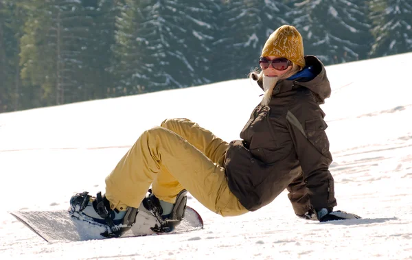 Snowboard girl on a hill — Stockfoto