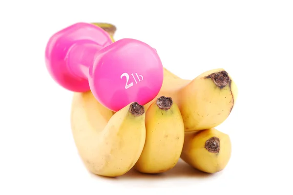Banana and dumbbells — Stock Photo, Image