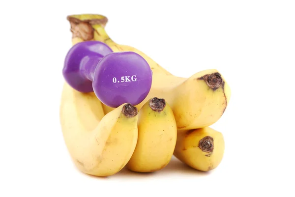 Banana and dumbbells — Stock Photo, Image