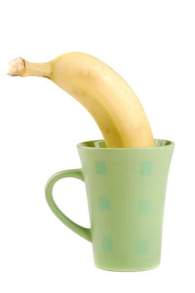 Yellow banana in a cup — Stock Photo, Image