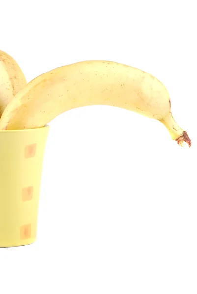 Žlutý banán v šálku — Stock fotografie