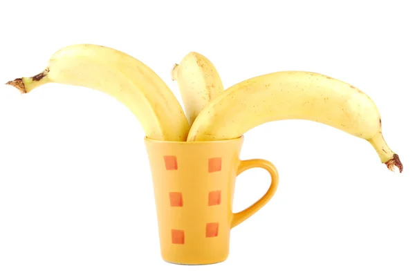 Žlutý banán v šálku — Stock fotografie
