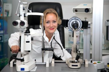 Doctor in ophthalmology lab clipart